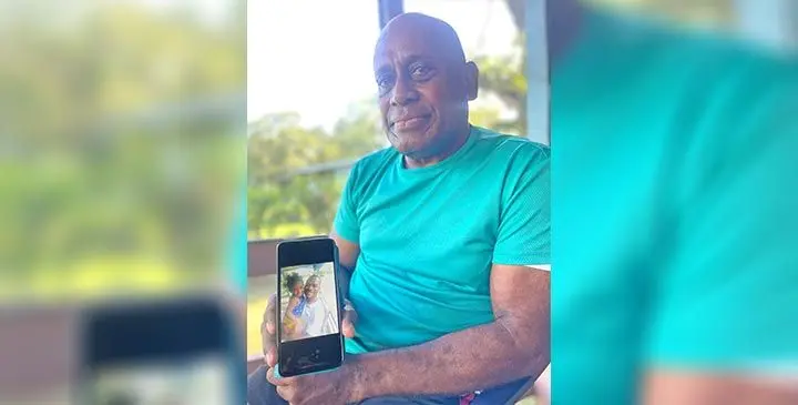Simione Naitutu, with a photo of Osea Naitutu, who died in a suspected h it-andrun accident along Bau Rd in Nausori on June 15, 2025. Photo: Rariqi Turner