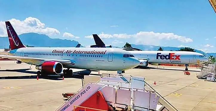FedEx Express and Omni Air International aircraft at the Nadi International Airport.