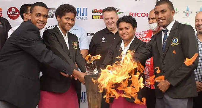 The official lighting of the Coca-Cola Games torch by Ratu Kadavulevu School long and triple jump athlete, Vatiliai Sautonia, Adi Cakobau School athlete Mareta Lewawai, Coca- Cola Amatil general manager (Fiji)Roger Hare, Mereoni Qiaqia of ACS and Vilikesa Vonolagi of RKS at the Coca-Cola (Fiji) headquarters, Laucala Beach, Suva on August 11, 2022. Photo: Ronald Kumar