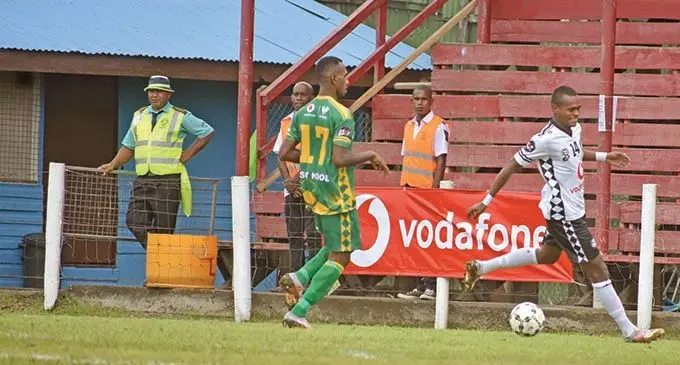 LEFT: Suva striker Sairusi Nalaubu (right) against Nadi at Subrail Park, Labasa. Photo: Renu Radhika