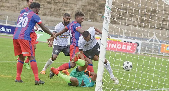 Veteran Ram Cleaning Services/AFL Suva defender Remueru Tekiata clashes with Koromakawa Tours & Rentals/GO2 Navua goalkeeper Viliame Rakuro during their Courts Interdistrict Championship pool clash. Photo: Ronald Kumar