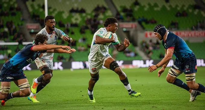 Swire Shipping Fijian Drua openside flanker Kitione Salawa (with ball) on attack with Joseva Tamani in support against the Rebels at AAMI Park in Melbourne, Australia, on March 25, 2022. Photo: Kumar’s Media.