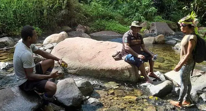 Provincial Administrator (PA) Namosi Mr. Laisenia Tui take a rest during their 14-hour journey by foot to visit rural communities in the upper Wainimala areas.