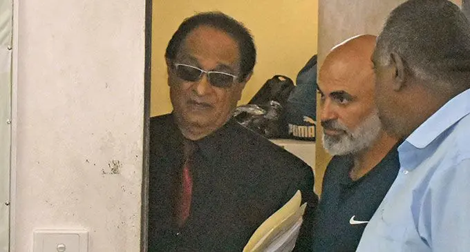 Sam Amine (centre)  lawyer Iqbal Khan (Left) outside court.