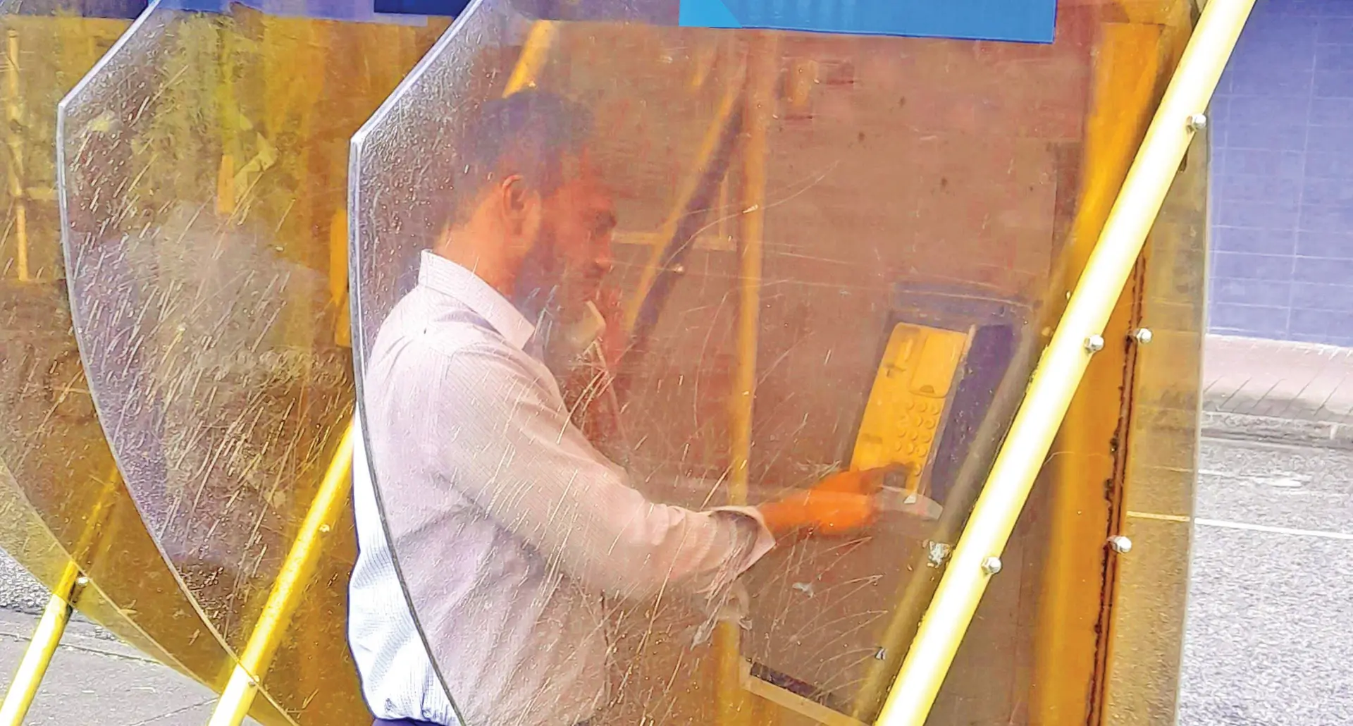 A customer making a call using a payphone owned by Telecom Fiji Limited.