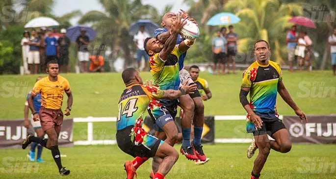 Police Blue playmaker Waisea Nacuqu in an aerial battle against Raiwasa Taveuni during their Super Sevens Series Cup final at Sigatoka’s Lawaqa Park on January 23, 2021. Police Blue won 7-5. Photo: Leon Lord