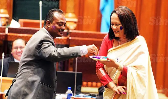 Sharing the Holi colours..Assistant Minister for Transport Vijay Nath and Minister for Education Rosy Akbar after Parliament session on March 26, 2021. Photo: Ronald Kumar.