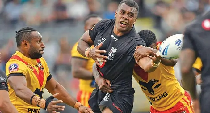Vodafone Fijian Bati forward Ben Nakubuwai delivers a pass against PNG Kumuls in 2019. Bati won 22-20. Photo: NRL.com