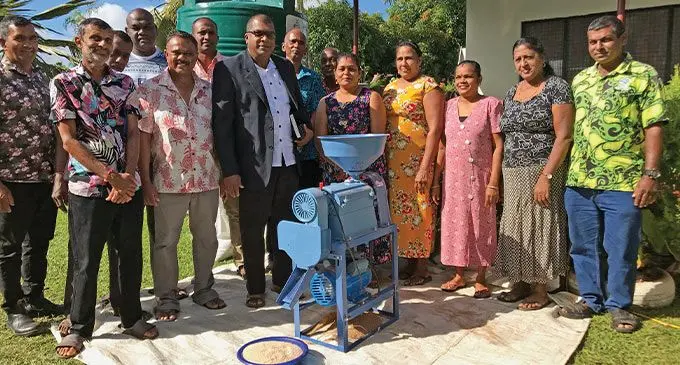 Minister for Agriculture Mahendra Reddy (middle) with the members of Naleba Cooperatives after the handover of a portable rice mill in Naleba, Labasa on August 24, 2022. Photo: Shratika Naidu