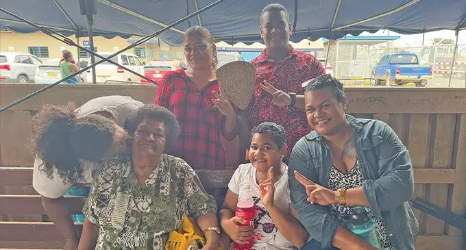 Taufa family with their grandmother, Temalesi Taufa yesterday at the Suva Wharf waiting area on Monday. Photo: Asenaca Ratu