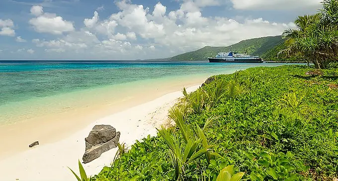 A local passenger vessel is birthed at a jetty on Koro Island.