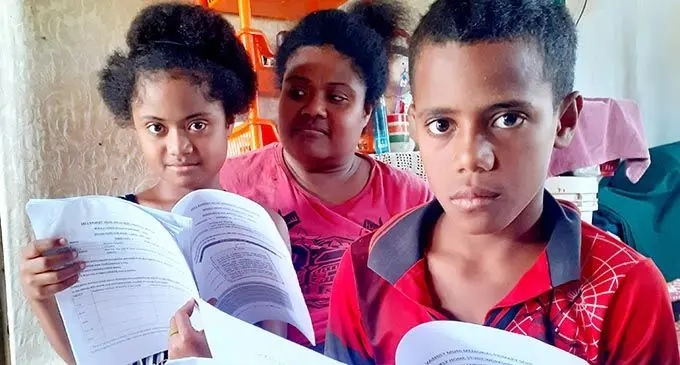Taufa Rakobuli with her children, Jeremaia Ratumaiyala and Maketalena Rakobuli at their home in Wainividio  Settlement in Navua on August 31, 2021. Photo: Ronald Kumar