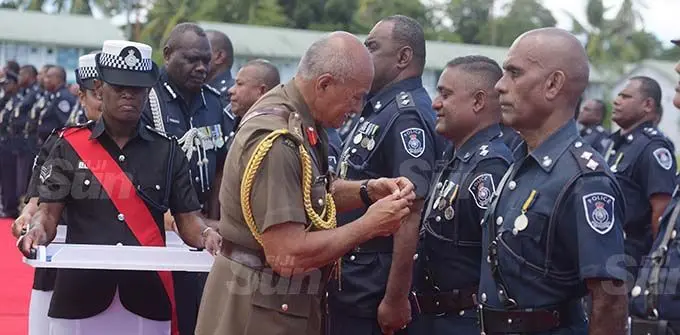 President Jioji Konrote awards Inspector Parmesh Chand with 50th anniversary of Independence commemorative Medal at Police Nasova ground on November 13, 2020. Photo: Ronald Kumar.