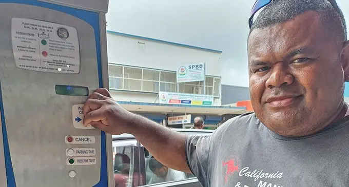Apisai Koroi using digital parking meter in Labasa Town on December 22, 2023. Photo: Shratika Naidu