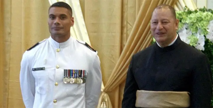 Warrant Officer Seaman Combat Specialist Mark Latu with King Tupou VI during the Tongan ruler’s recent 60th birthday celebrations.