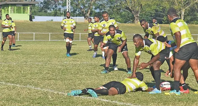 Swire Shipping Fijian Latui winger Joeli Lutumailagi stands over a team-mate as halfback Henry Seniloli (obscured) to deliver to a waiting Johnny Dyer during training at Prince Charles Park, Nadi on June 18, 2019. Photo: Mereleki Nai