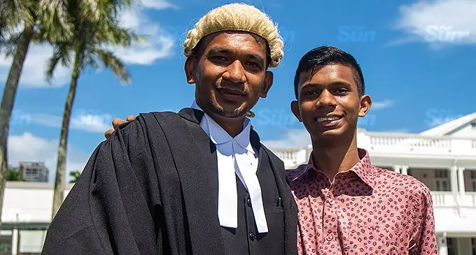 Lawyer, Mohammed Aruf Yasin (left) with his son Nasir Al Musawwir Yasin after his admission to the Bar at the Grand Pacific Hotel in Suva on Friday, November 19, 2021. Photo: Leon Lord.