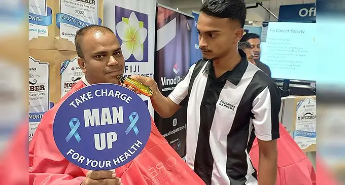 Vinod Patel staff Ratinesh Kumar (left) during the Movember launch at Vinod Patel, Centre Point branch on November 1, 2022. Photo: Ronald Kumar