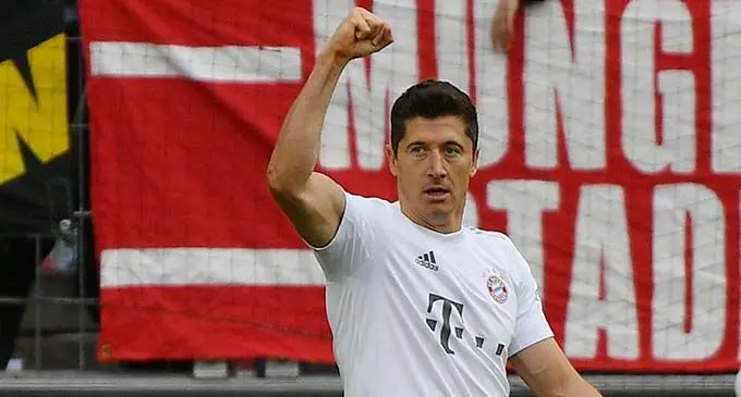 Robert Lewandowski of Bayern Munich celebrates for his goal during a German Bundesliga match between FC Bayern Munich and FC Cologne in Cologne, Germany, Feb. 16, 2020. (Photo by Ulrich Hufnage/Xinhua)