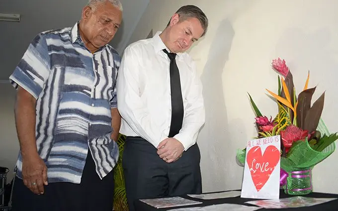 Prime Minister Voreqe Bainimarama with New Zealand High Commissioner to Fiji Jonathan Curr reading condolence messages from Fijians to the people of Christchurch, NZ, after the opening prayer at Makoi Women’s Vocational Centre on March 17, 2019.  Photo: Simione Haravanua