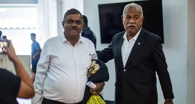 Former FijiFirst MP, Vijendra Prakash (L) alongside SODELPA MP Simione Rasova outside  the Suva High Court on September 19, 2022. Photo- Leon Lord 