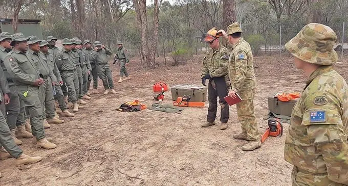 Members of the Republic of Fiji Military Forces engineering contingent are briefed as they prepare for tasks in the Orbost region in Victoria, Australia.  Photo: Australian Department of Defence