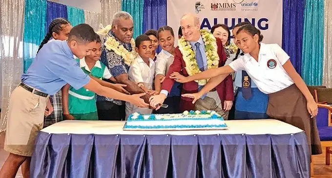 United Nations Children’s Fund Pacific Island Representative Sheldon Yett with school students cut the World Water Day celebrations cake at Kshatriya Hall in Suva on March 22, 2021. Photo: Inoke Rabonu.