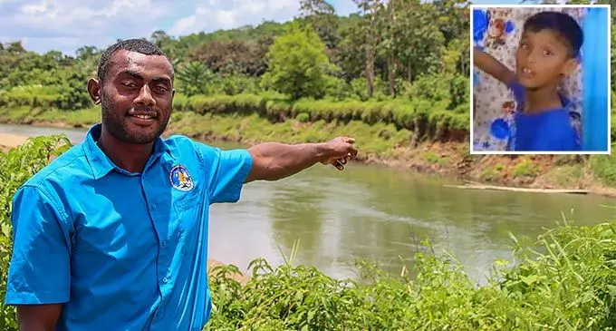 Asiveli Devo pointing at the spot at Waimanu River, where he had retrieved 10-year-old Prince Naitik Prasad. Photo: Jone Salusalu Inset: Lucky 10-year-old, Prince Naitik Prasad