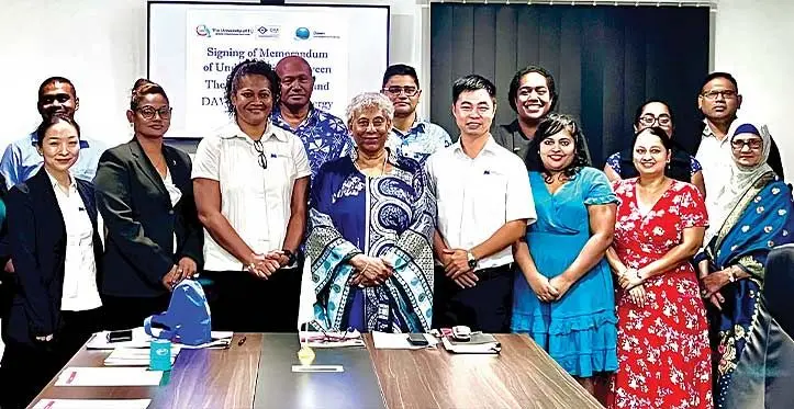Staff of The University of Fiji and Dawn Energy Renewable (Fiji) Ltd after the signing of the memorandum of understanding between the two organisations.