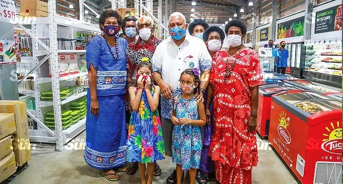 Prime Minister Voreqe Bainimarama with his grand daughters and shoppers at True Mart Sabeto, on October 14, 2021. Photo: Leon Lord.