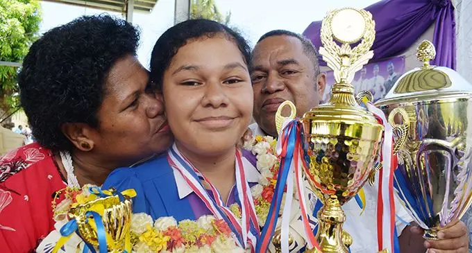 Dudley High School 2020 Dux of the Year recipient Esther Naua with parents, Repeka and Epeli Naua with her awards following their Year 12 and 13 annual prize giving ceremony and graduation ceremony at the School hall on December 1, 2020. Photo: Ronald Kumar