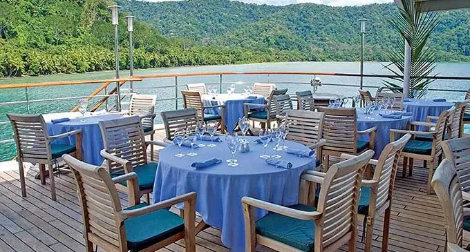 MS Caledonian Sky aft deck allows passengers comfortable outside dining.