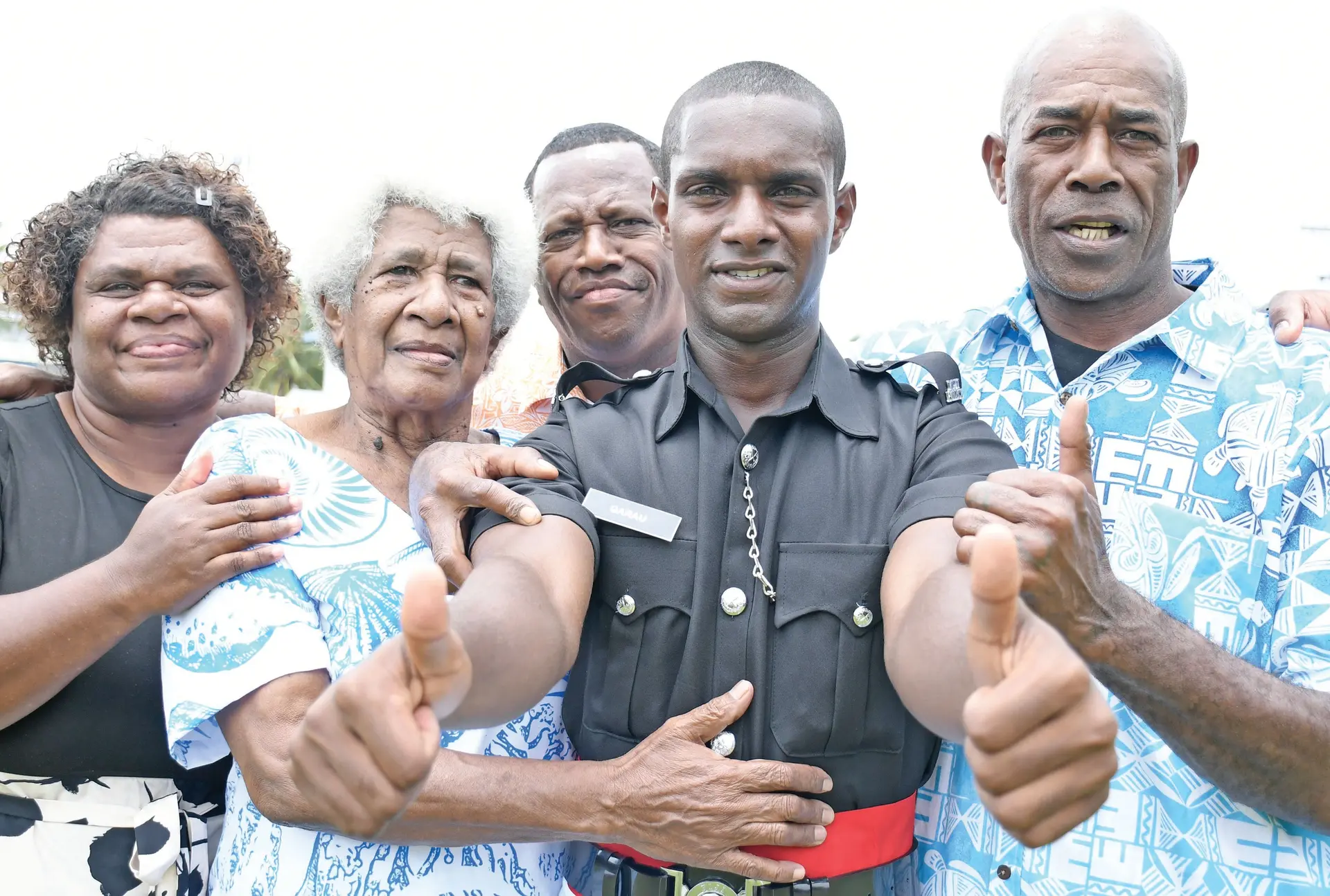 James Qarau with father (right) Sitiveni Qarau and family members at the Police batch 68 basic recruits course passing out parade  at Nasova grounds in Suva on December 19, 2025.