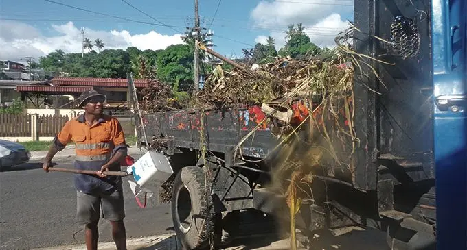 Sitiveni Vakatuni of the Lautoka City Council clearing rubbish from the roadside in Lautoka City. Photo: Waisea Nasokia
