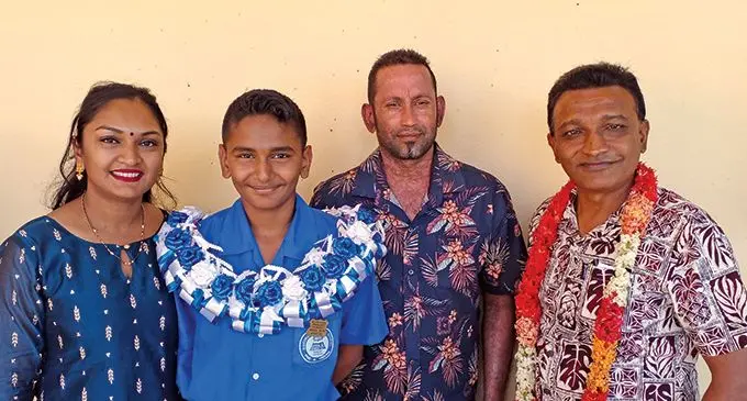 From left: Anipa Chandra with her son the Gurukul Primary School Head boy Aayaan Naidu, husband Munnesar Naidu and  Pandit Vishnu Deo Memorial College Principal Ravindra Deo Varman on May 13,2022. Photo: Salote Qalubau