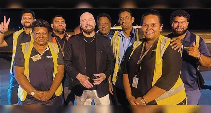 John Travolta with Nadi International airport staff.