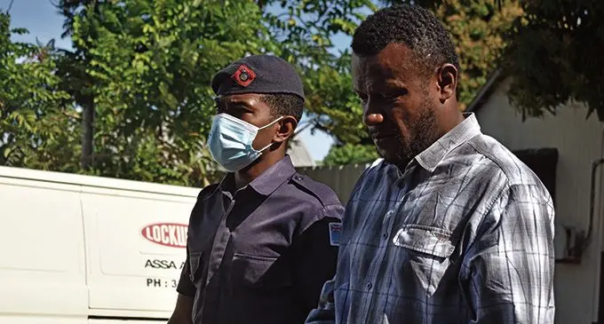 Isei Tamanikalou escorted by a Police Officer at the Nadi Magistrates Court on Monday, July 5, 2021  Photos: Mereleki Nai