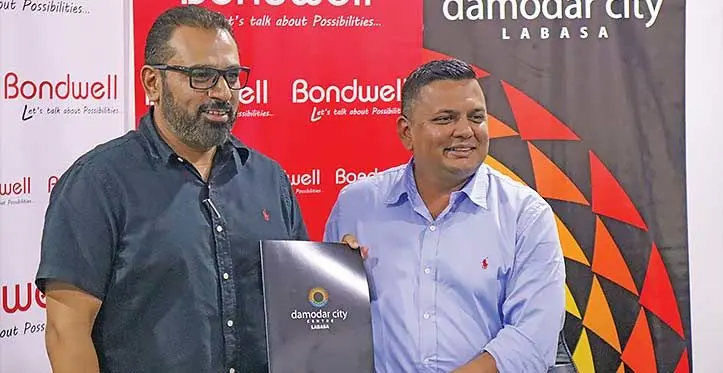 Janty Bondwell general manager, Jeetesh Kumar and Damodar Group chief executive officer, Div Damodar after a signing ceremony in Suva on July 12, 2023. Photo: Jernese Macanawai