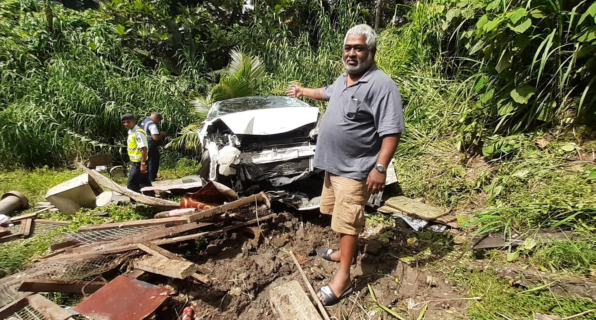 Rajesh Kumar outside his home in samabula. His Saturday afternoon was full of surprises as car veered off the road and into his compound. 