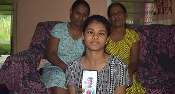 Back: Shobna Devi (left, victim’s mother) and Maya Wati (victim’s grandmother) Front: Aaliya Aaira (victim’s sister) at Togomasi in Nadi. Photo: Mereleki Nai