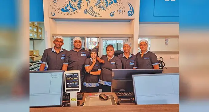 Fourth from left: Bhikhabhai sales and operations manager, Roseline Chand, with staff outside their newly opened shop at the Damodar City complex in Labasa Town on July 20, 2023. Photo: Sampras Anand