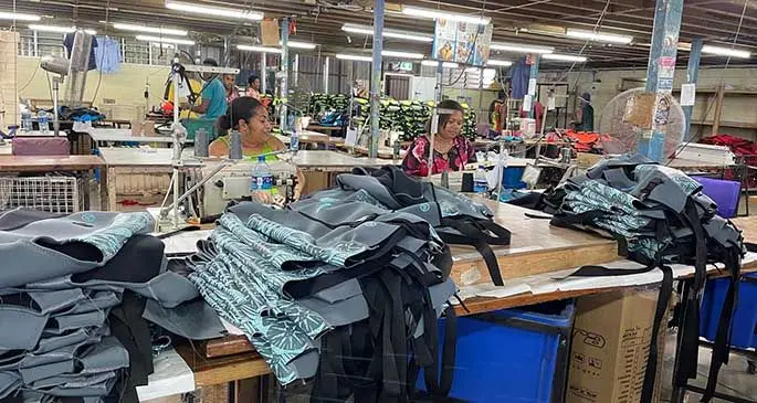 Factory workers at Performance Flotation Development factory, Nabua, before the COVID-19 pandemic.