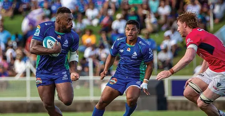 Swire Shipping Fijian Drua winger Eroni Sau (with ball) confronts Rebels captain Brad Wilkin (right) with Philip Baselala in support during their Shop N Save Super Rugby Pacific clash at the HFC Bank Stadium, Suva, on April 1, 2023. Photo: Leon Lord