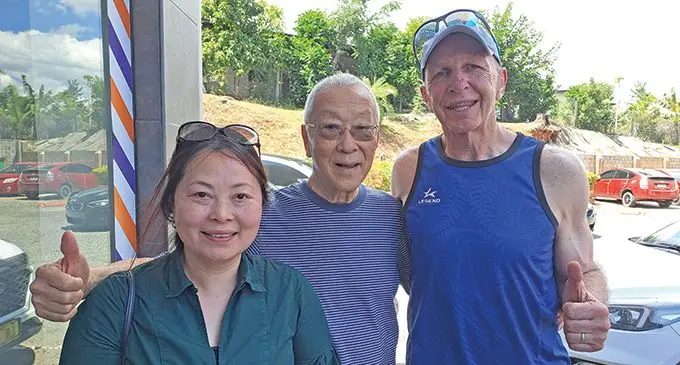 From left: Mandy Tan, Legend Sportswear Co Ltd owner/chief executive officer Dr Looi Tan, and former All Blacks 7s coach, Sir Gordon Tietjens, in Nadi on September 8, 2022. Photo: Waisea Nasokia