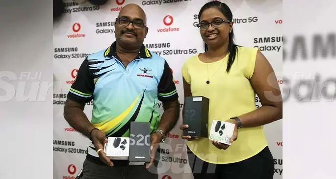 From left: Sachida Nand and Heenal Kumar with their new Samsung S20 Ultra 5G smartphone. Photo: Laiseana Nasiga