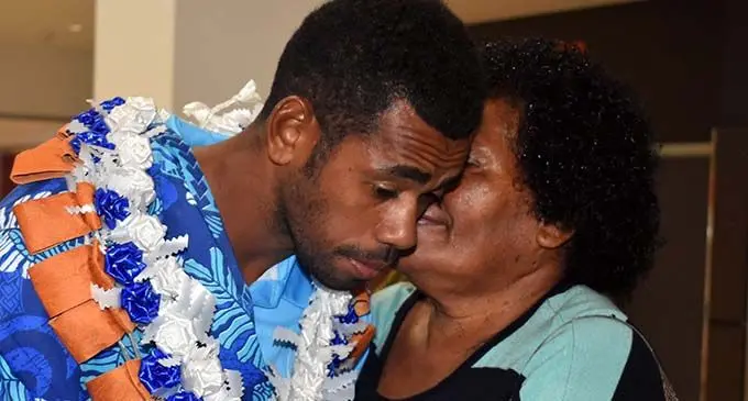 Fiji Airways 7s rep Isoa Tabu is greeted by his mother at Nadi International Airport on March 13, 2019  Photo: Waisea Nasokia
