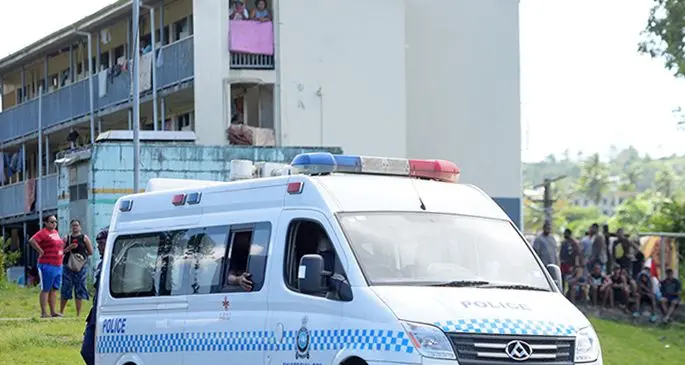 Police officers outside Nabua PRB flats following the brawl in Nabua on April 13, 2021. Photo: Ronald Kumar.