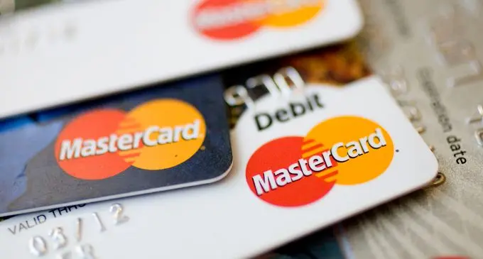 MasterCard logos appear on credit and debit cards arranged f