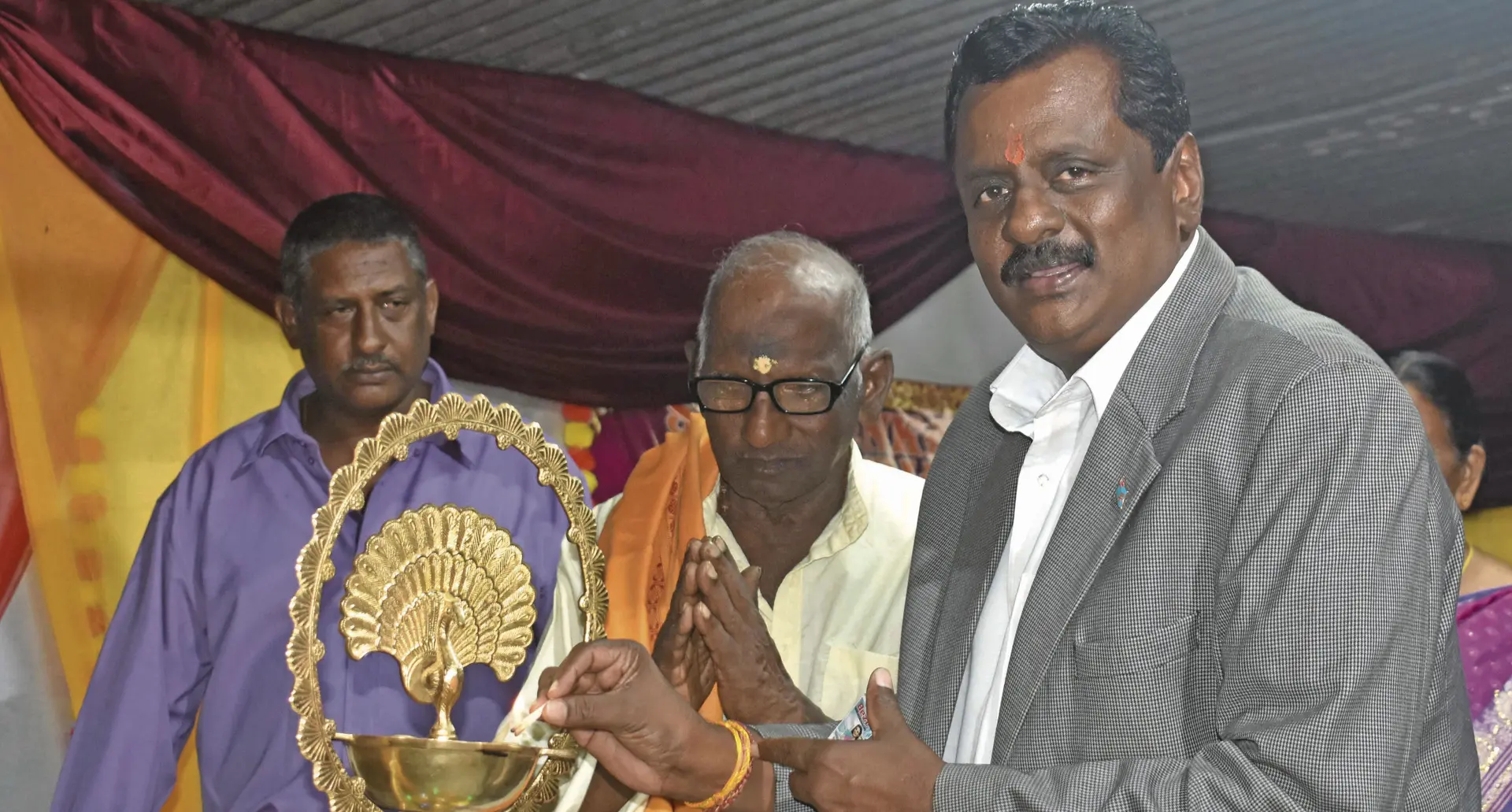 Minister for Youth and Sports Parveen Kumar with Pujari Palgan Mistry during the celebration on Friday night.  Photo: Waisea Nasokia