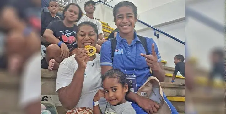Visila Kolitapa (holding gold medal) with daughter Merewalesi Kolitapa at the FMF Gymnasium on June 28, 2025.